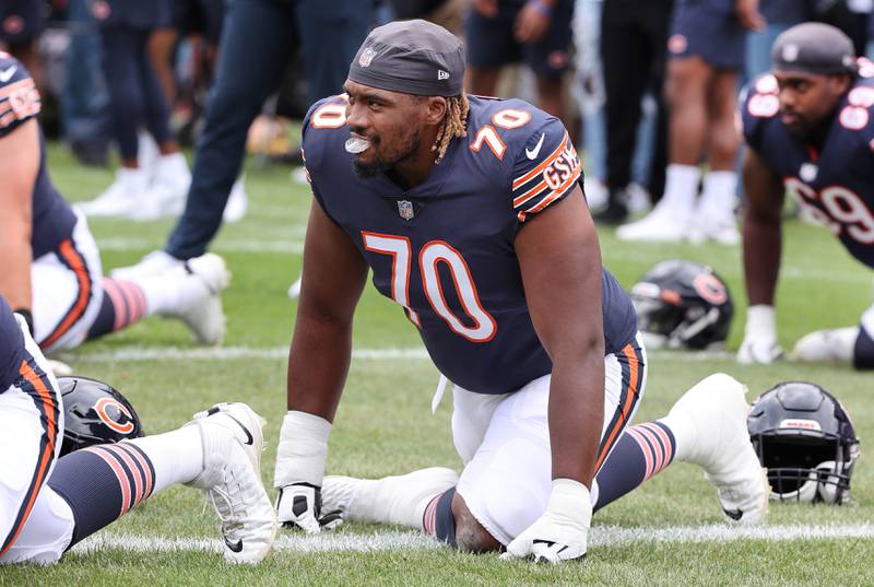 Chicago Bears offensive tackle Braxton Jones stretches before the Bears take on the Kansas City Chiefs in a 2022 game at Soldier Field in Chicago.