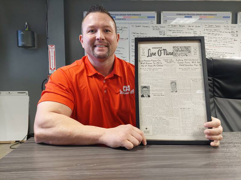 Tommy Nagle has a copy the Line O Nine newspaper featuring his grandfather Ervin Plimmer, who worked at Owens for 37 years.