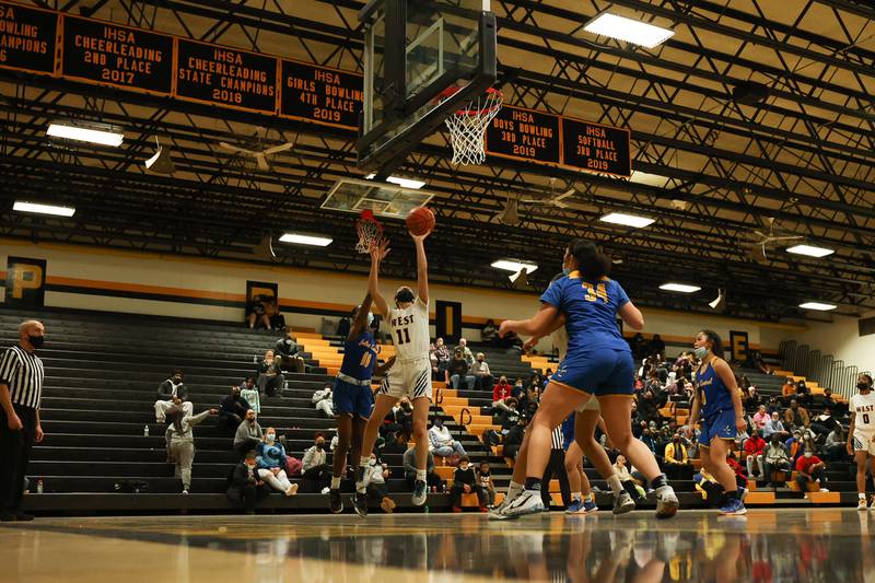 Joliet West’s Caiside Snapp takes a shot against Joliet Central. Tuesday, Feb. 8, 2022, in Joliet.