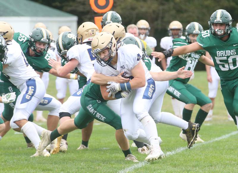 Marquette's Grand Dose runs the ball against St. Bede during the Homecoming game on Saturday, Sept. 28, 2024 at St. Bede Academy.