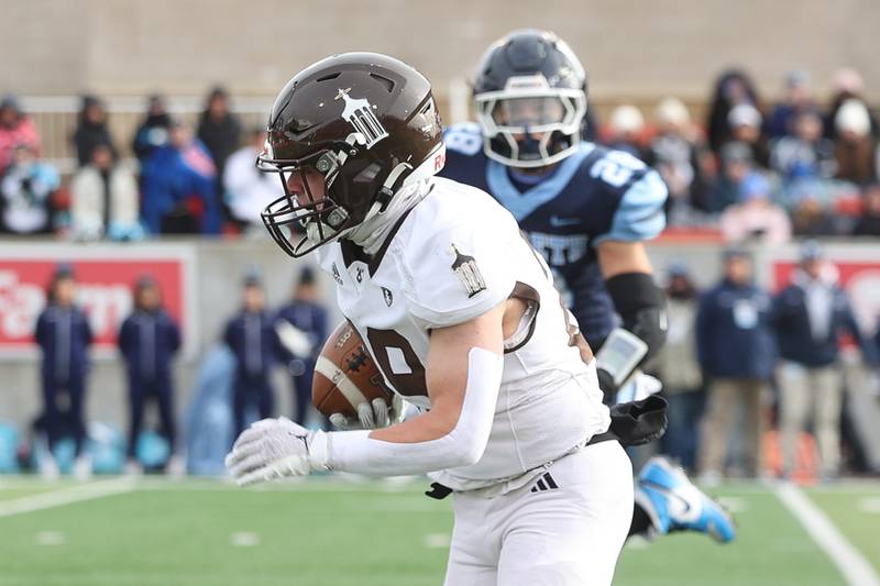 Joliet Catholic’s Keegan Farnaus breaks away for a touchdown run against Nazareth in the Class 5A state championship on Saturday, Nov. 30, 2024 in Normal.
