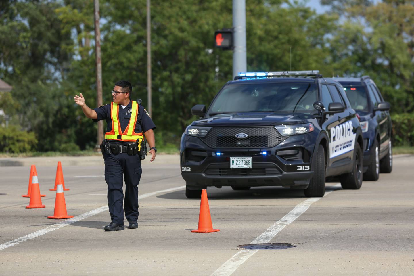 Investigators with the McHenry Police Department spent hours taking photos and gathering evidence at the intersection of Illinois Route 31 and Bull Valley Road on Sunday, Aug. 29, 2021 after a report of shots fired in the area around 1:25 p.m.