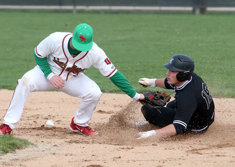 Kaneland's Collin Miller is safe at second base as L-P's Billy Mini misses the throw on Wednesday, April 5, 2023 at Dickinson Field in Oglesby.