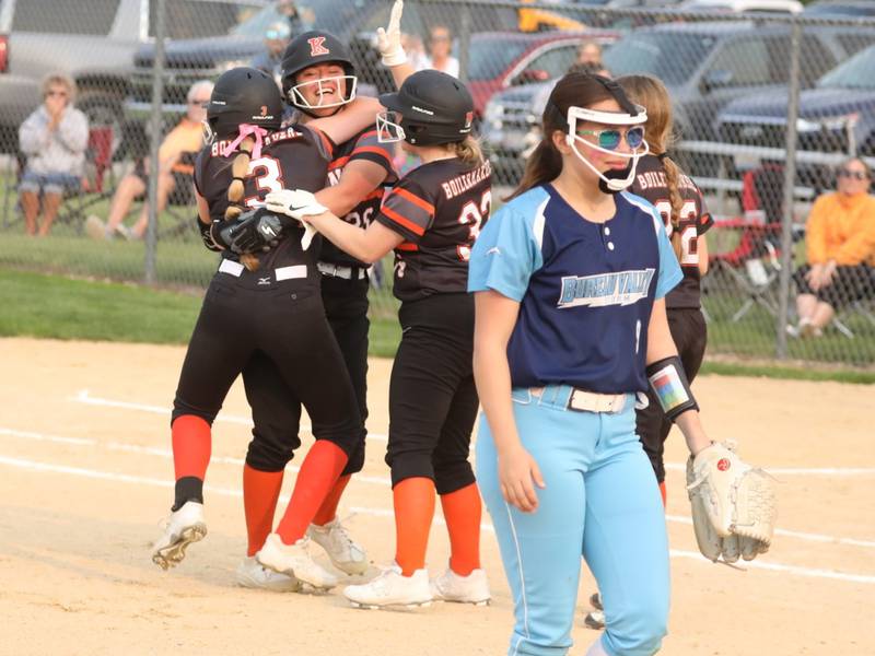 Kewanee players celebrate their walk-off, 4-3 regional semifinal win, as Bureau Valley Madison Smith walks off the field in Wednesday at Princeton.