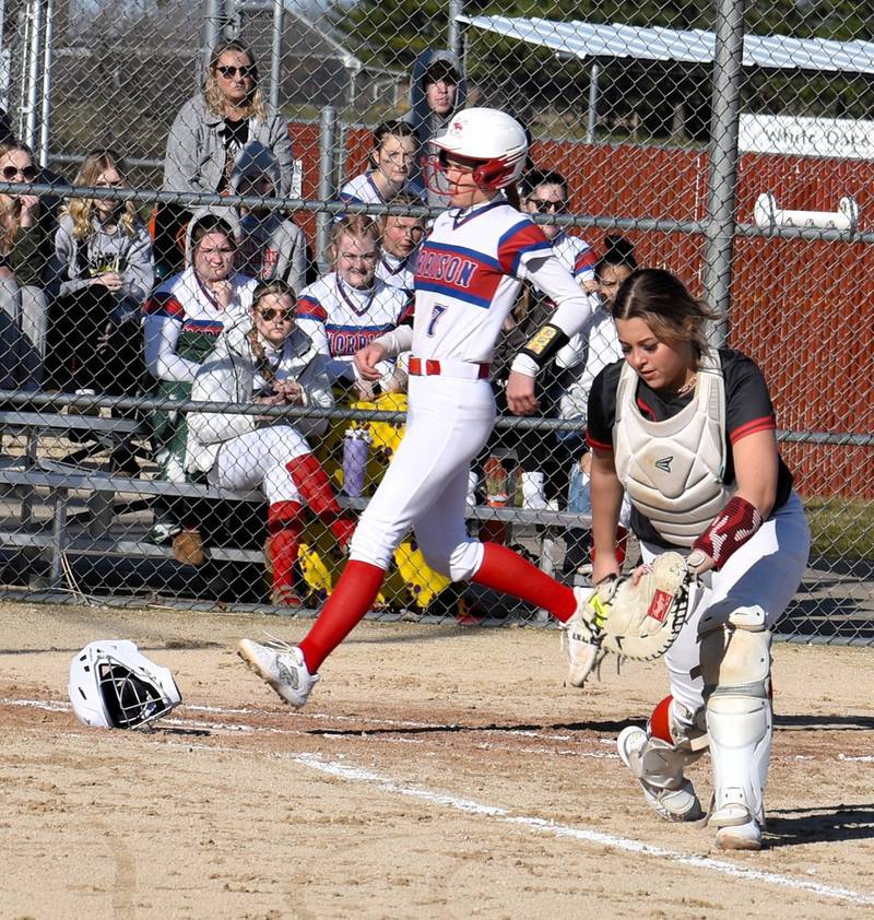 Morrison's Bella Duncan (7) runs across home plate during a game against Fulton on Friday, March 15 at the Morrison Sports Complex.