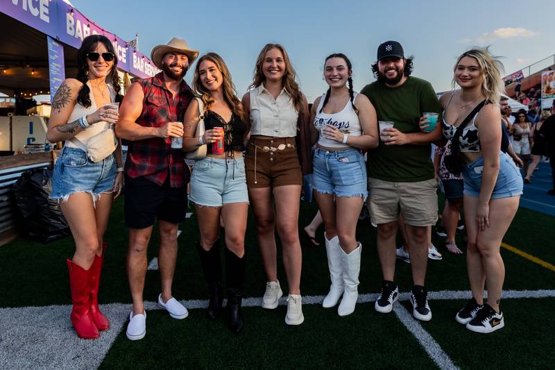 Danielle Dickover, C.J. Silva, Briana Rodriquez, Taylor Toth, Becca Sanfratello, Mike Sanfratello, and Ana Sanfratello enjoy country music night at Taste of Joliet on June 21, 2025.
