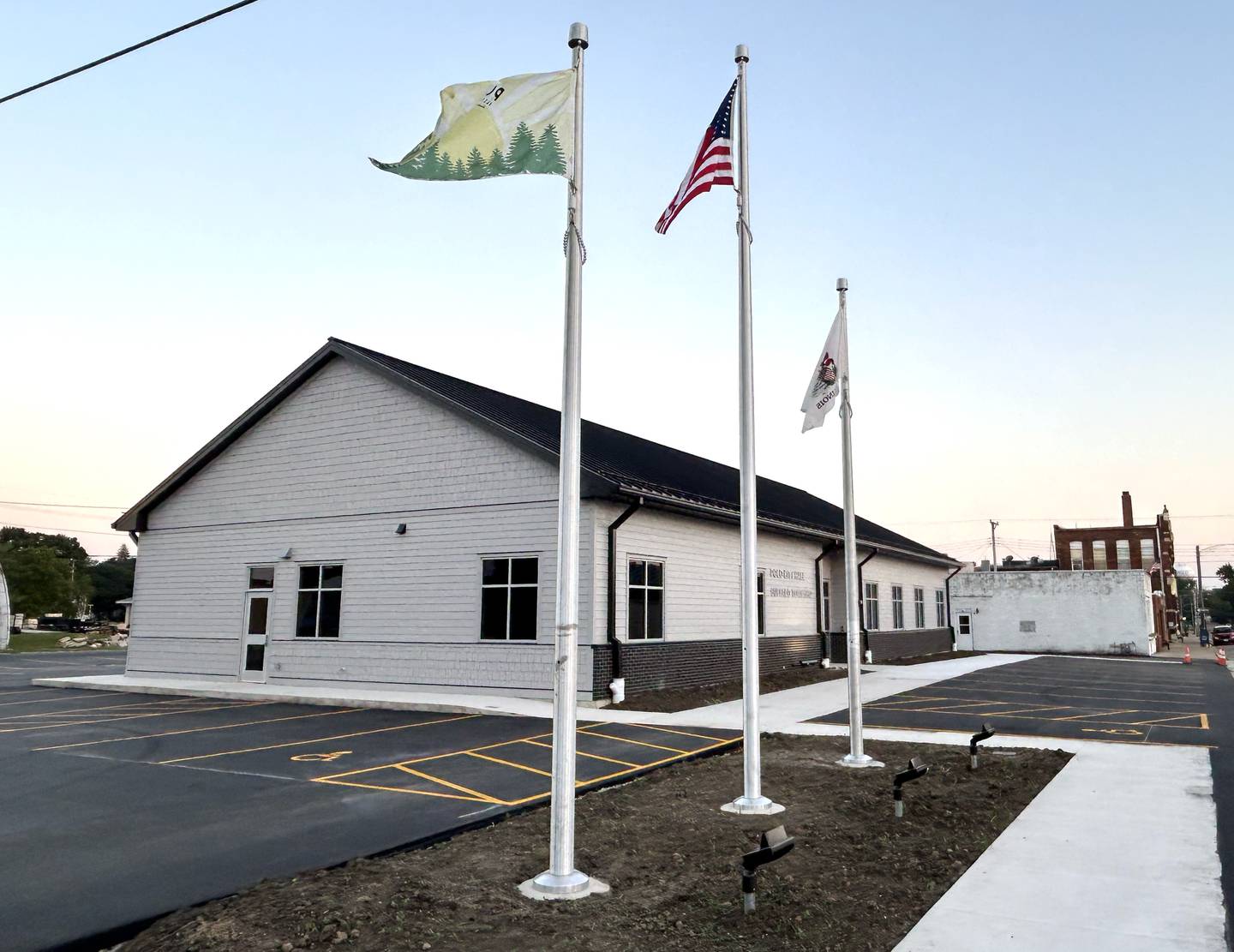 Three flags fly next to the new Polo City Hall and Buffalo Township building at 118 N. Franklin Ave., in Polo. on Monday, Aug. 26, 2024.