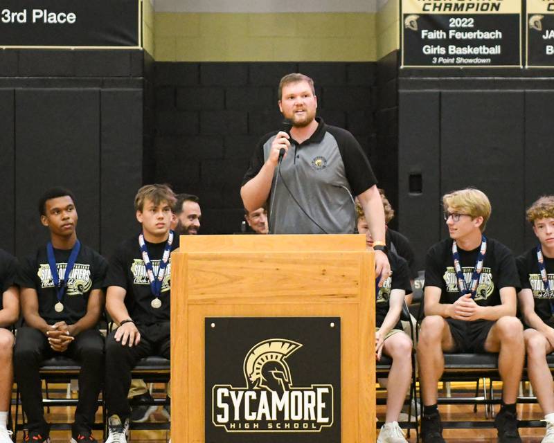 Sycamore head boys track coach Matt Kosecki talks during the pep rally on Tuesday June 4, 2025, at Sycamore High School after the team brought back the championship trophy.