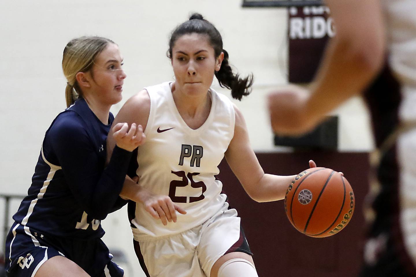 Prairie Ridge's Addie Meyer drives against Cary-Grove's Malaina Kurth during a Fox Valley Conference girls basketball game Wednesday, Jan. 17, 2024, at Prairie Ridge High School.