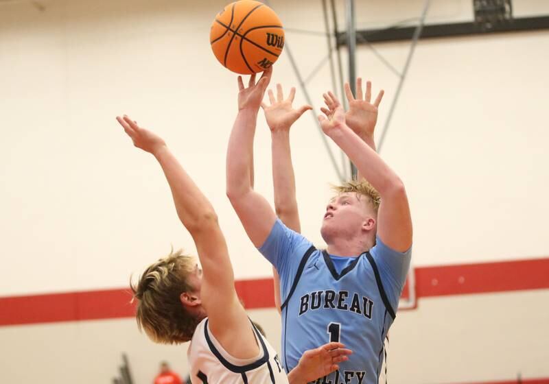 Bureau Valley's Bryce Helms lets go of a shot over Fielcrest's Eddie Lorton during the 50th annual Colmone Classic on Monday, Dec. 9, 2024 at Hall High School.