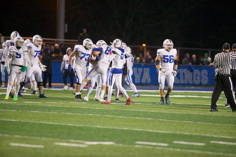 Burlington Central celebrates an interception against Geneva at the Class 6A second-round playoff game on Saturday Nov.9,2024 in Geneva.