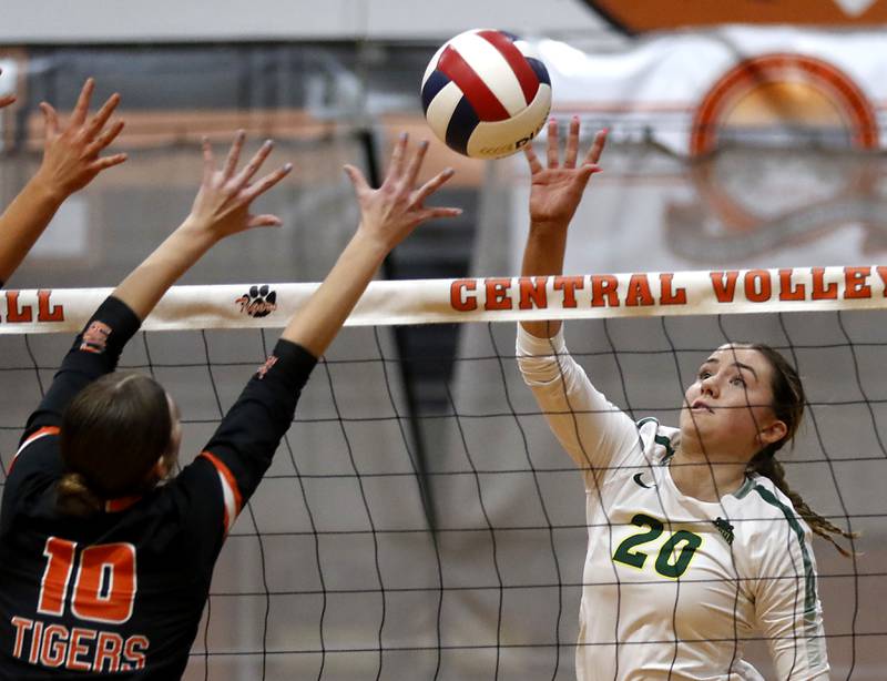 Crystal Lake South's Morgan Johnson tries to hit the ball past the block of Crystal Lake Central's Marin McCain during the IHSA Class 3A Crystal Lake Central Regional volleyball final on Oct. 31, 2024, at Crystal Lake Central High School.