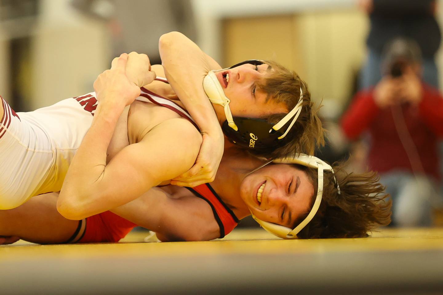Minooka’s Dominic Schiavone rolls Moline’s Alec Schmacht in the 126lb 1st place match at the Class 3A Joliet West Regionals. Saturday, Feb. 5, 2022, in Joliet.