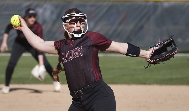 Prairie Ridge's Emma Dallas throws a pitch during a Fox Valley Conference softball game against Crystal Lake Central on Monday, April 20, 2026, at Prairie Ridge High School.