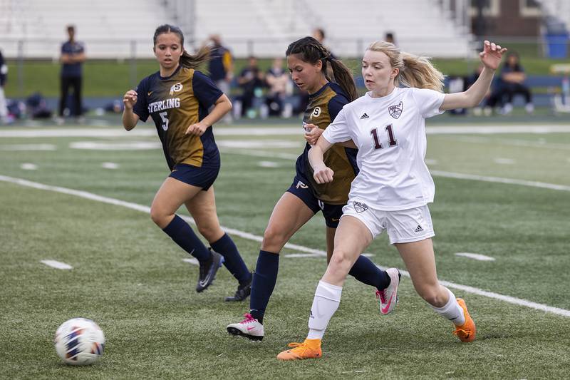 Moline’s Hannah McNall and Sterling’s Sophia Torres battle for the ball Tuesday, April 30, 2024 at Sterling High School.