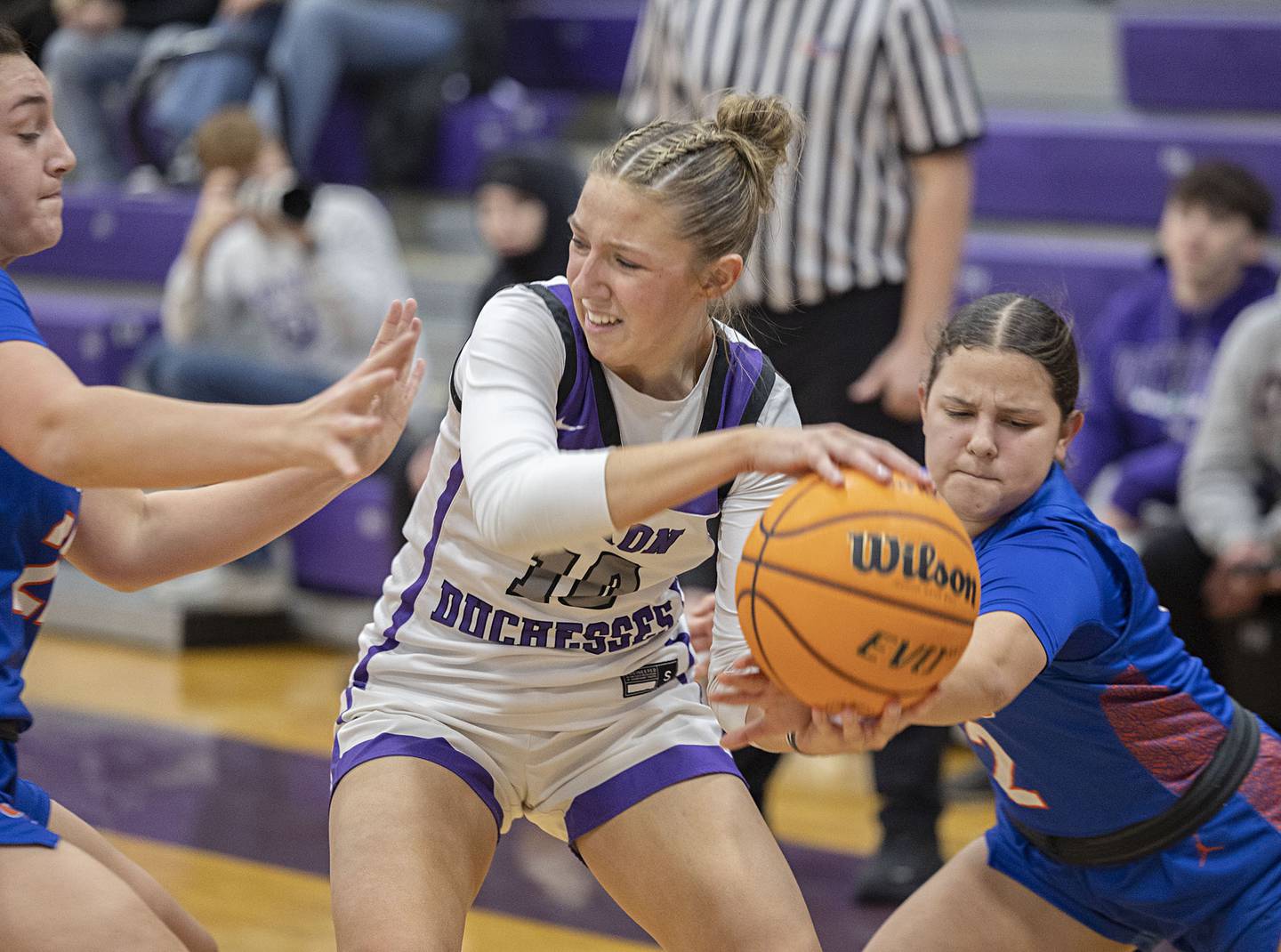 Dixon’s Addy Lohse looks to make a play while being defended by G-K’s Regan Creadon (left) and Ayva Hernandez Tuesday, Jan. 27, 2026.