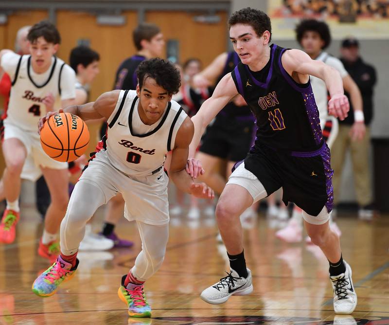 Benet’s Blake Fagbemi is off on a fast break after stealing the ball from Downers Grove North’s Jack Crowley during the Class 4A Benet Sectional championship game on March 7, 2025 at Benet Academy in Lisle.