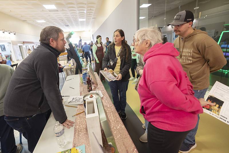 Darrell Wallace, owner of The Rusty Fox in Sterling speaks to customers at his booth Sunday, Feb. 2, 2025, at the Sauk Valley Wedding Expo in Sterling.