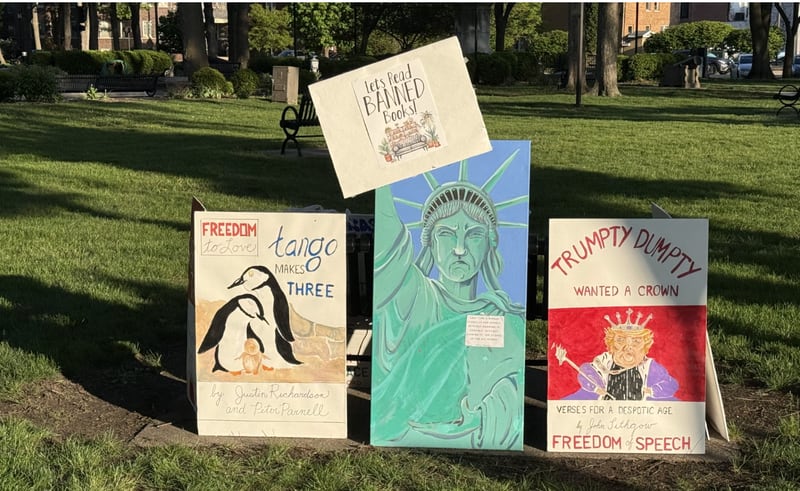 Some of the artwork from Friday night's "May Day Rally" at Washington Park in Ottawa, supporting workers' wages and the First Amendment.