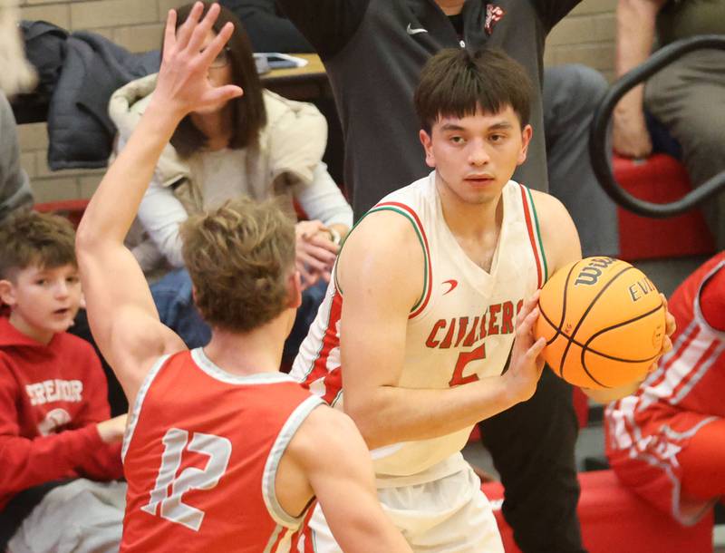 L-P's Erick Sotelo looks to shoot a shot over Streator's Riley Stevens during the Dean Riley Shootin' The Rock Thanksgiving Tournament on Monday Nov. 24, 2025 in Kingman Gymnasium at Ottawa High School.