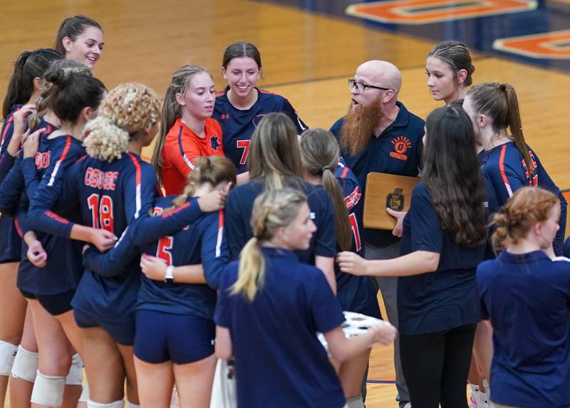 Oswego’s head coach Gary Mosley talks to his team during a break in play against Rosary during a volleyball match at Oswego High School on Tuesday, Aug 29, 2023.