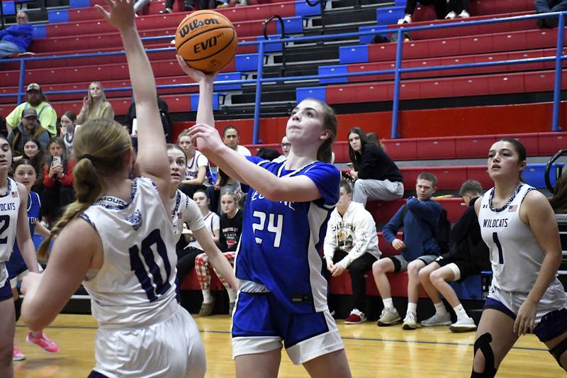 Peotone's Payton Pape sets to shoot while Wilmington's Taylor Stefancic contests during Peotone's 35-32 victory over Wilmington in the Iroquois West Holiday Tournament on Wednesday, December 17, 2025.