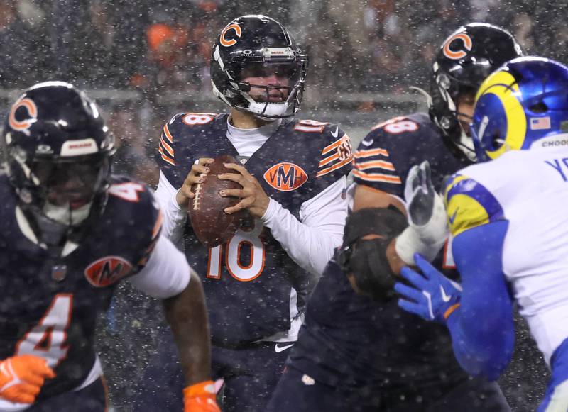 Chicago Bears quarterback Caleb Williams looks for a receiver Sunday, Jan. 18, 2026, during their NFC divisional playoff matchup against the Los Angeles Rams at Soldier Field in Chicago.
