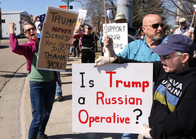 Protesters voice their displeasure with President Donald Trump Friday, March 14, 2025, in front of the DeKalb County Courthouse in Sycamore. The group was protesting recent cuts by the Trump administration to the Department of Veterans Affairs.
