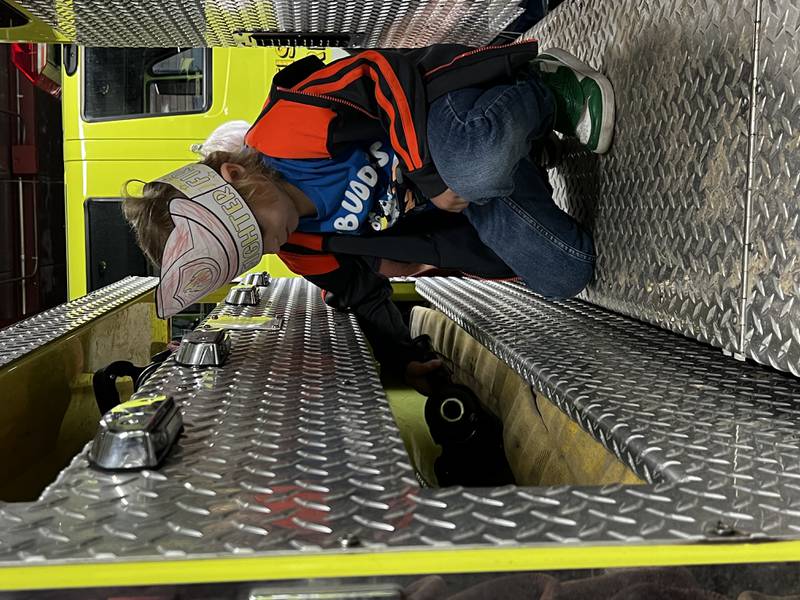 Bureau County Special Schools third grader Mikey Stedman exploring a Tiskilwa Fire Department fire truck