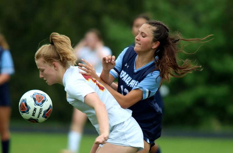 Richmond-Burton’s Margaret Slove, left, battles DePaul Prep’s Dylan Greene during sectional title game action at Marian Central in Woodstock Friday evening.