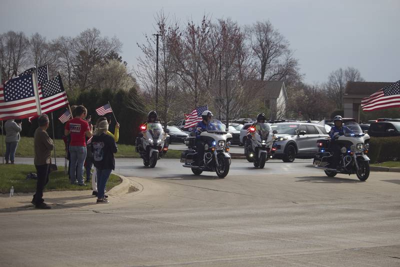 Attendees on Friday, April 18, 2025, outside Tezak Funeral Home in Joliet, for the funeral procession for U.S. Army Staff Sgt. Jose Dueñez Jr. He was one of four soldiers who died March 31, 2025 when their armored vehicle sunk in a bog during a training mission in Lithuania.