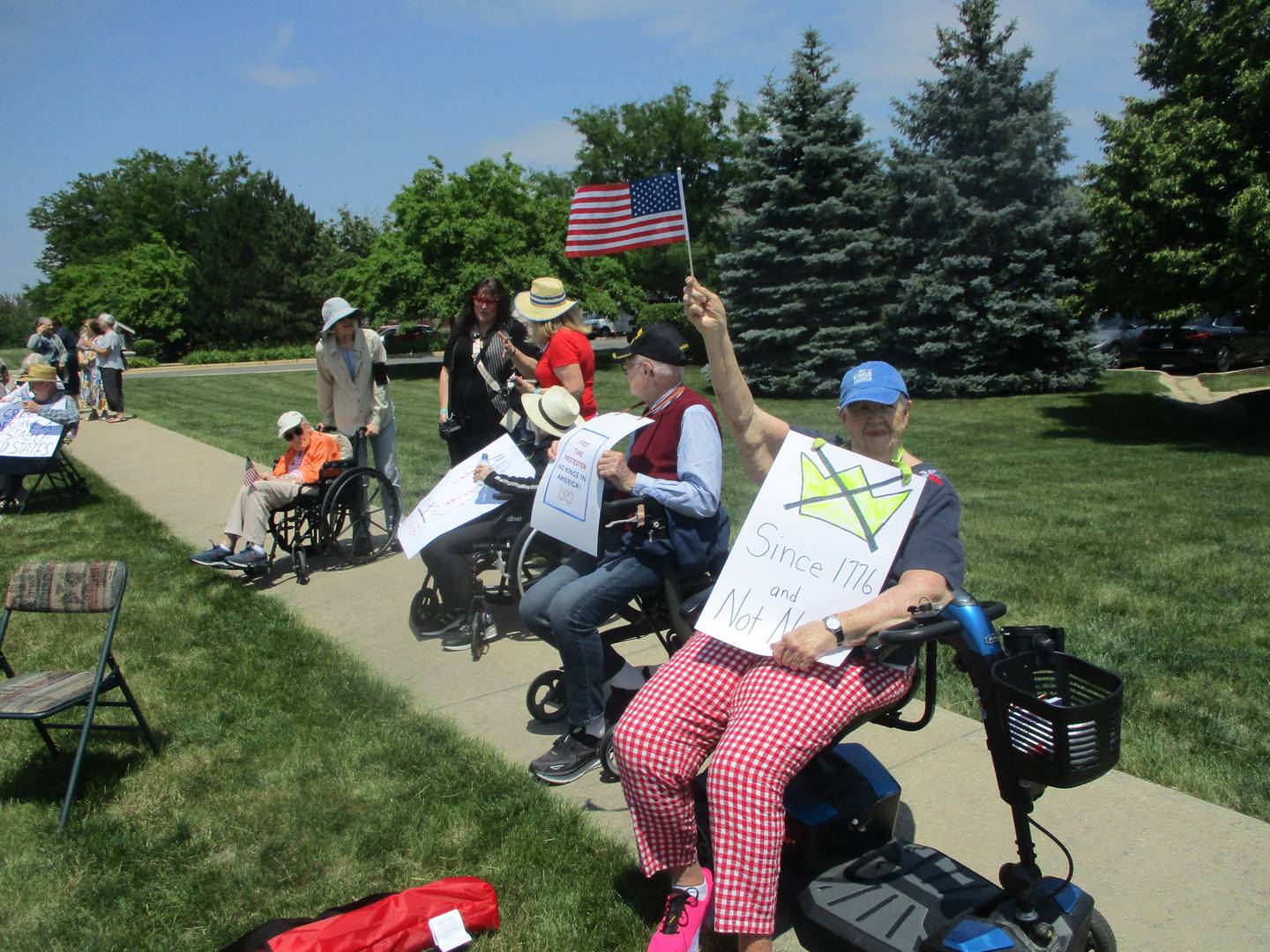 Jeanne Engstrom joins other residents of the Timbers of Shorewood in a protest on Saturday against actions taken by the Trump administration. June 14, 2025