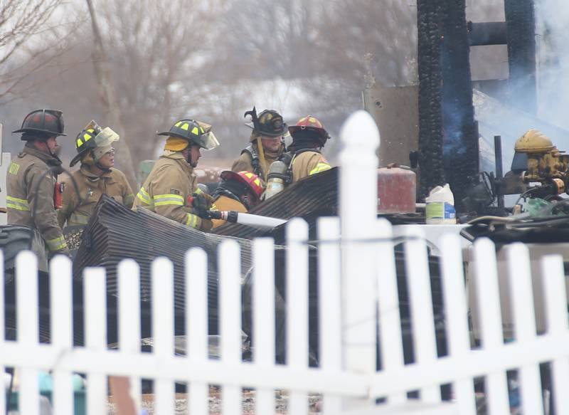 Firefighters spray water on a structure fire in the 4000 block of East 16th Road on Thursday, Feb. 5, 2026 near Earlville. Fire departments from Serena, Mendota, Troy Grove and others were dispatched shortly after 12p.m. to the fire. The fire was upgraded to the second alarm through the Mutual Aid Box Alarm System (MABAS 25) shortly after.