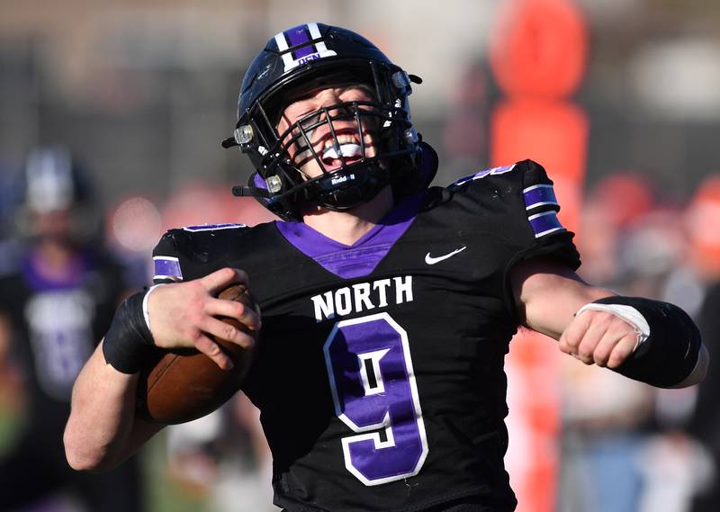 Downers Grove North's Jimmy Janicki reacts in the end zone after his "pick six" interception for a touchdown during an IHSA Class 7A semifinal game against Normal Community on Nov. 18, 2023 at Downers Grove North High School in Downers Grove.