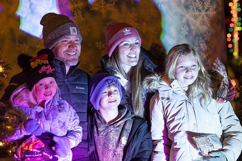 The Nagy family cheeses it for a picture Friday, Dec. 5, 2025, in downtown Dixon.