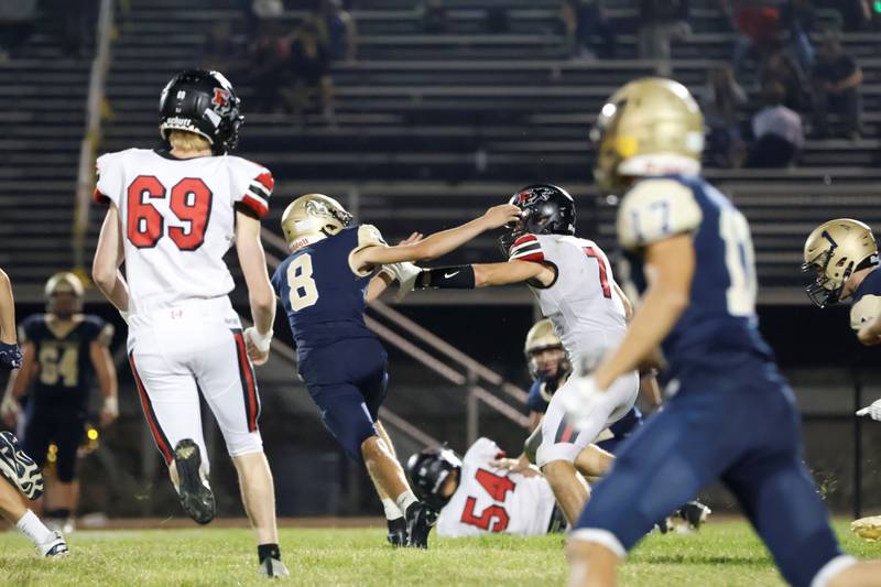 EP #7 Gaven Adams stiff armed his way past Mercer County #8 Cannon Link during the opening kick return of the 2nd half of the conference match between Mercer County Golden Eagles and the EP Panthers Friday evening. Adams would run the ball all the way to the endzone for his 2nd touchdown of the night to aide his team in their 43-15 victory over the hosting Golden Eagles.