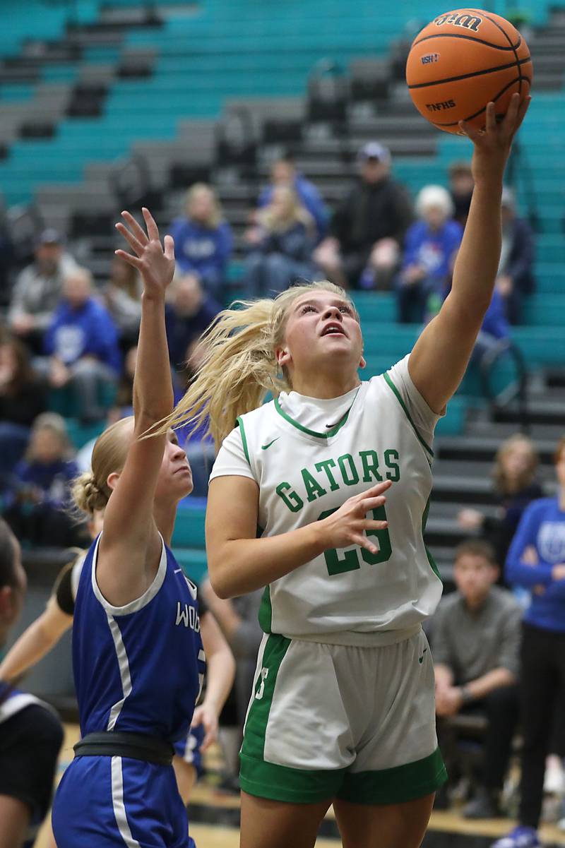 Crystal Lake South's Laken LePage drives to the basket against Woodstock's Emma Bierman during the IHSA Class 3A Woodstock North Regional championship girls basketball game on Thursday, Feb. 19, 2026, at Woodstock North High School.