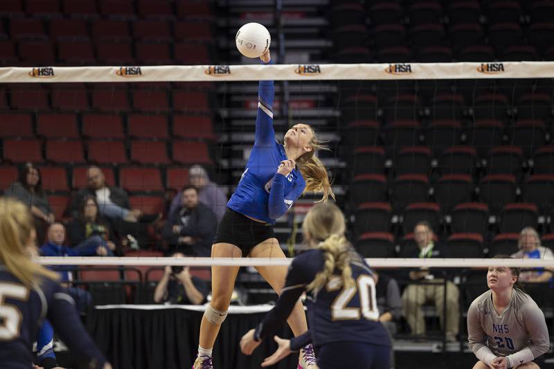 Newman’s Jess Johns spikes a shot Friday, Nov. 11, 2022 in a class 1A volleyball semifinal against Aquin.