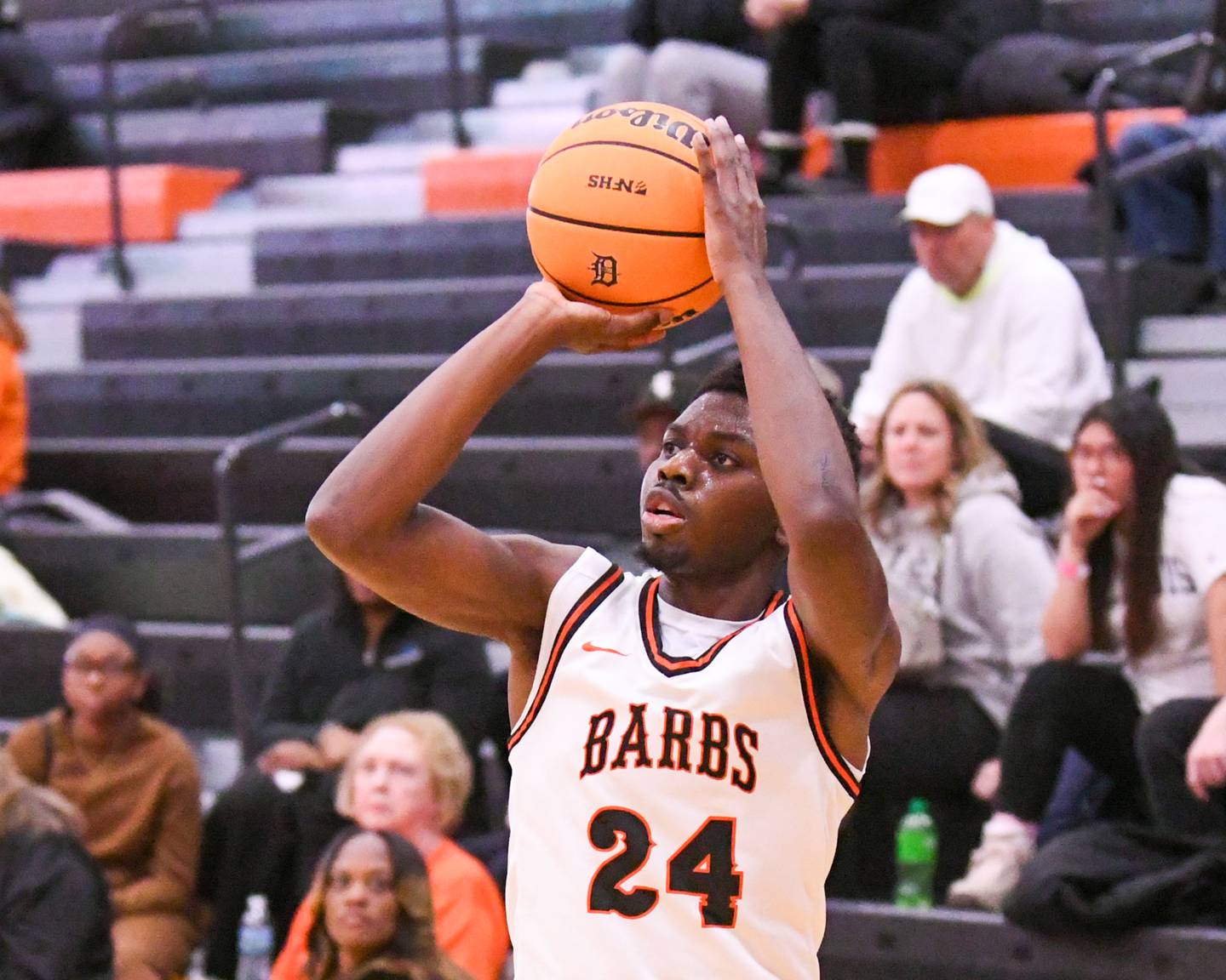 DeKalb's Myles Newman (24) makes a three-point basket during the third place Dayton Tournament game on Tuesday Dec. 30, 2025; while taking on United Township held at DeKalb High School.
