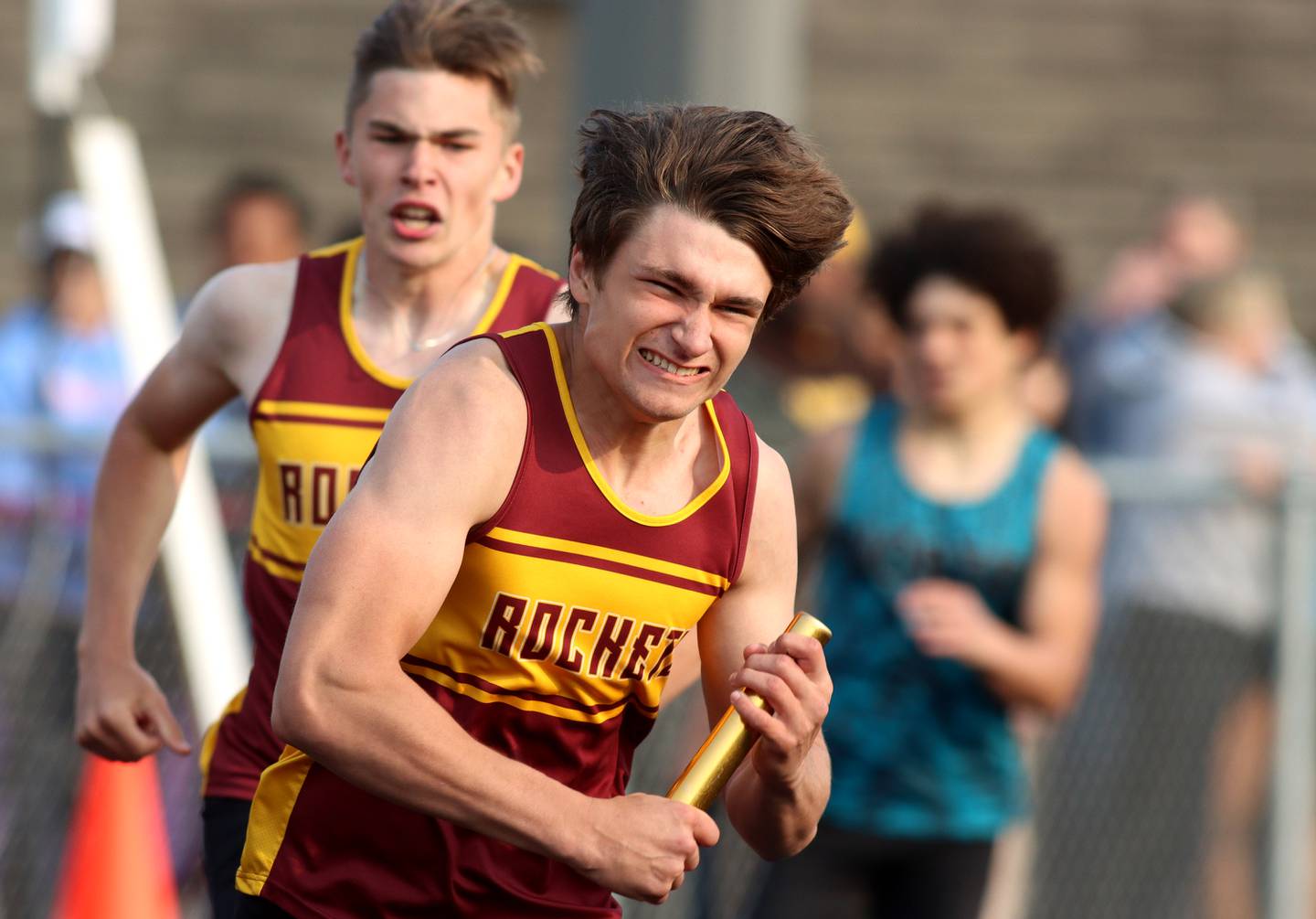 Richmond-Burton’s Dan Kalinowski, front, takes the baton from teammate Jack Martens in the 800-meter relay during Class 2A Sectional track at Hugh K. Funderburg Stadium on the campus of Belvidere High School Wednesday, May 17, 2023.