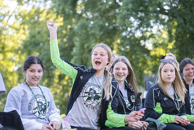 Members of the Rock falls volleyball team fire candy and other treats from their homecoming float Thursday, Sept. 22, 2022.