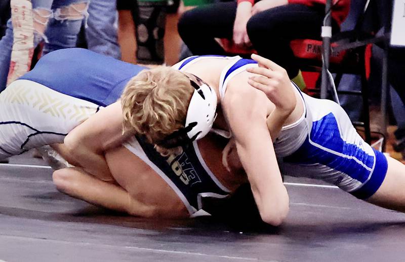 Newman's Landon Near works to pin Mercer County's Boston Morford on Saturday, Dec. 19, 2025, for the annual holiday wrestling tournament. Near took 1st over Morford for the 113 pound weight class
