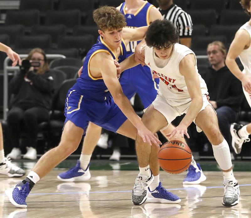 Johnsburg's Kyle Patterson tries to steal the ball from McHenry's Marko Visnjevac during a non-conference basketball game Sunday, Nov. 27, 2022, between Johnsburg and McHenry at Fiserv Forum in Milwaukee.