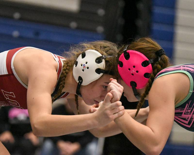 Veronica Skibicki of Lockport, left, goes head-to-head with Eva Hermansson of Woodstock in the 110-weight class championship match on Saturday Jan. 4, 2025, where Veronica took a 4-3 decision during the Aaron Dundley invite held at Oswego East High School.