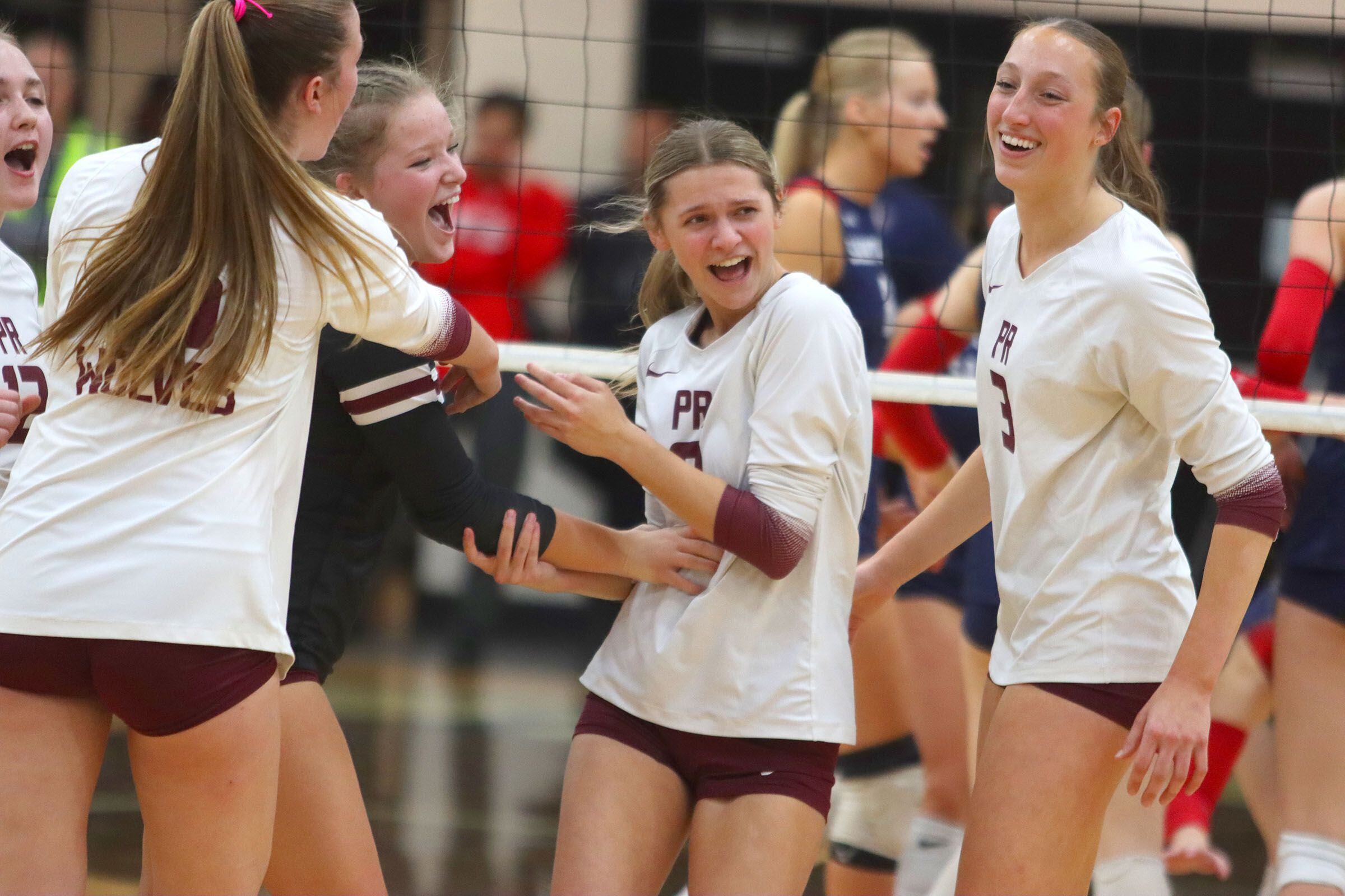 Prairie Ridge’s Wolves stay loose in the final set of a win over St. Viator in IHSA Class 3A Super-Sectional girls volleyball at Streamwood High School in Streamwood on Monday, November 10, 2025.