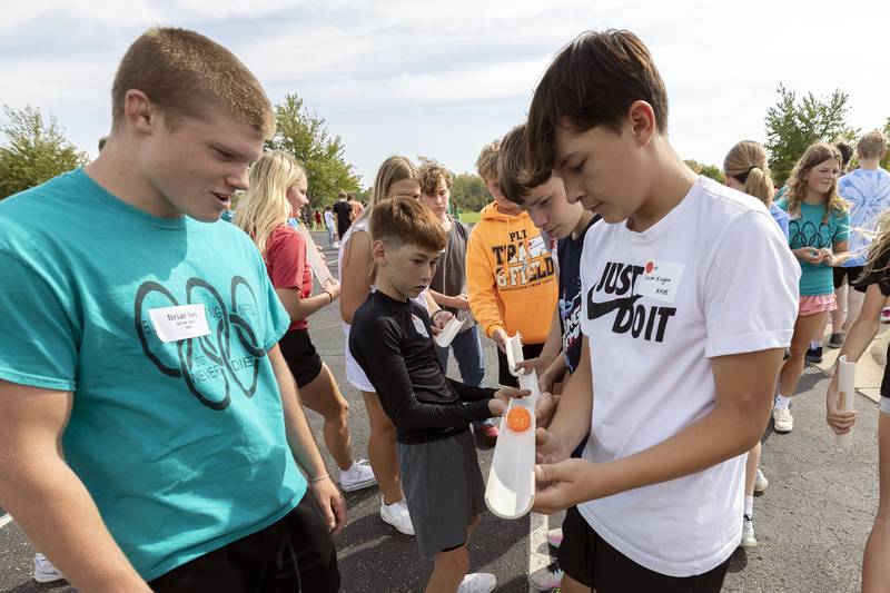 Students guide a ball down a chute by working together in the BLIND exercise Thursday, Sept. 19, 2024.