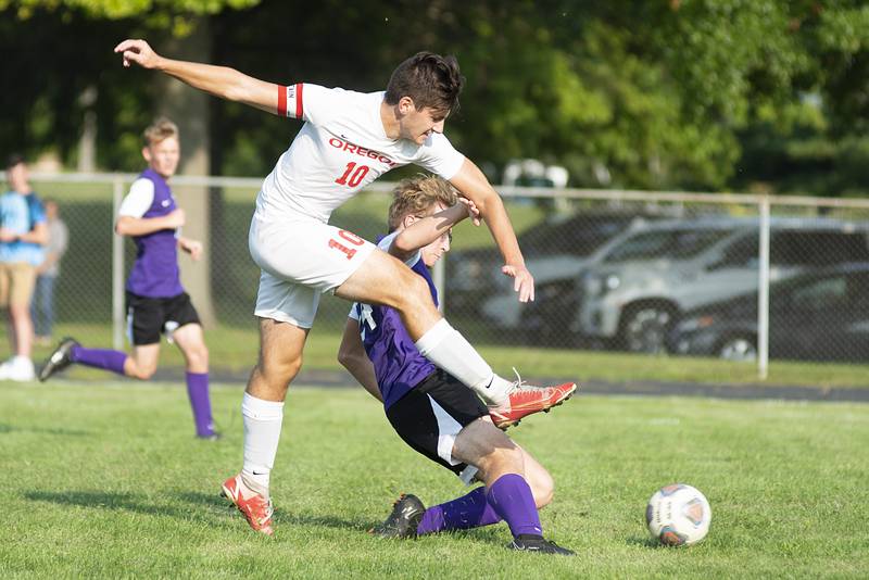 Oregon’s Jacob Vegliando takes a shot towards the goal while being defended by Dixon’s Zack Clevenger on Sept. 14, 2022.