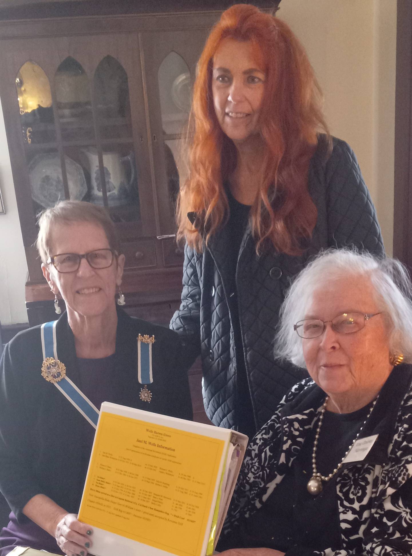 Rebecca Heaton, DAR state regent and Delores Nanninga, Kewanee Chapter, accepting Jani Wittmeyer Wells, standing, application on 7 Nov.  It was also the chapter 125th birthday celebration.