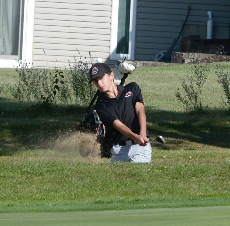 Fulton's Owen Vanzuiden hits out of a sand trap at the 1A Lanark Regional at Lake Carroll Golf Course on Wednesday, Oct. 2, 2024.