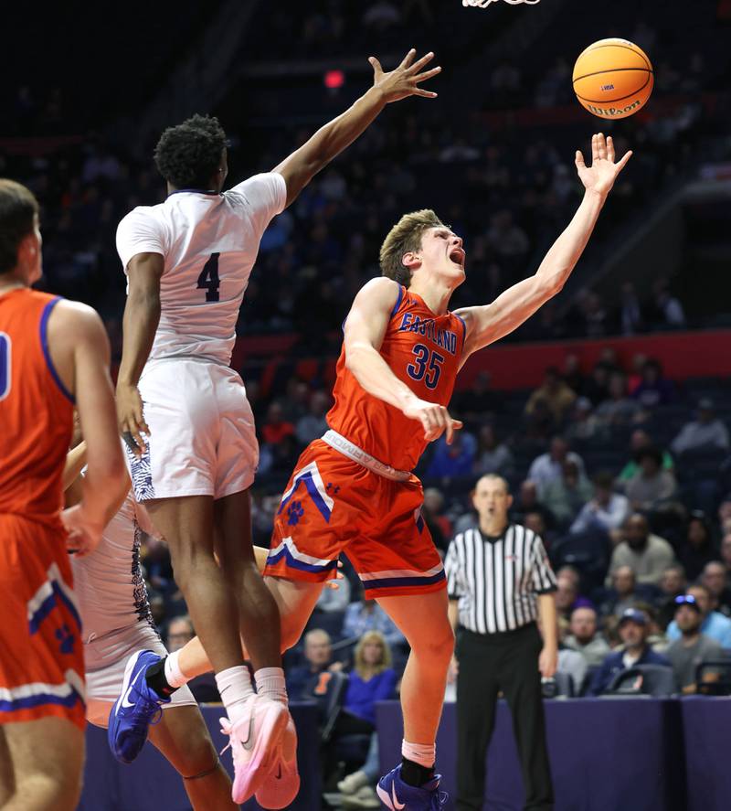 Eastland's Parker Krogman gets up a shot behind Chicago Hope Academy's Andre Mabry to get up a shot during their IHSA Class 1A state championship game Saturday, March 15, 2025, in the State Farm Center at the University of Illinois in Champaign.